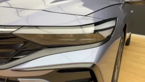 Front view of the 2025 Hyundai Elantra showing its LED DRLs and grille.