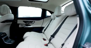 Mercedes-Benz E220D luxury sedan interior with triple screen dashboard